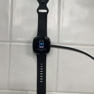 Black Fitbit Sense fitness tracker/smart watch and bands
